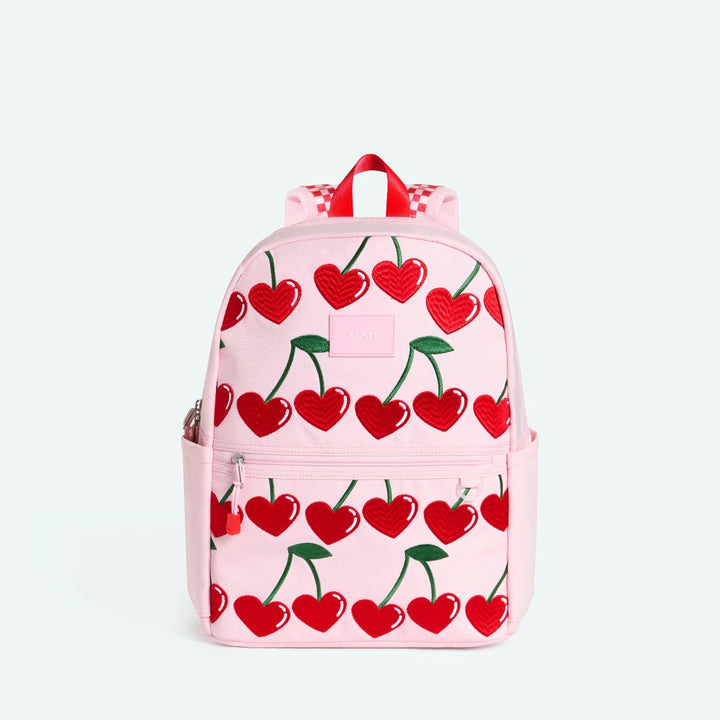 Pink backpack with red cherry pattern