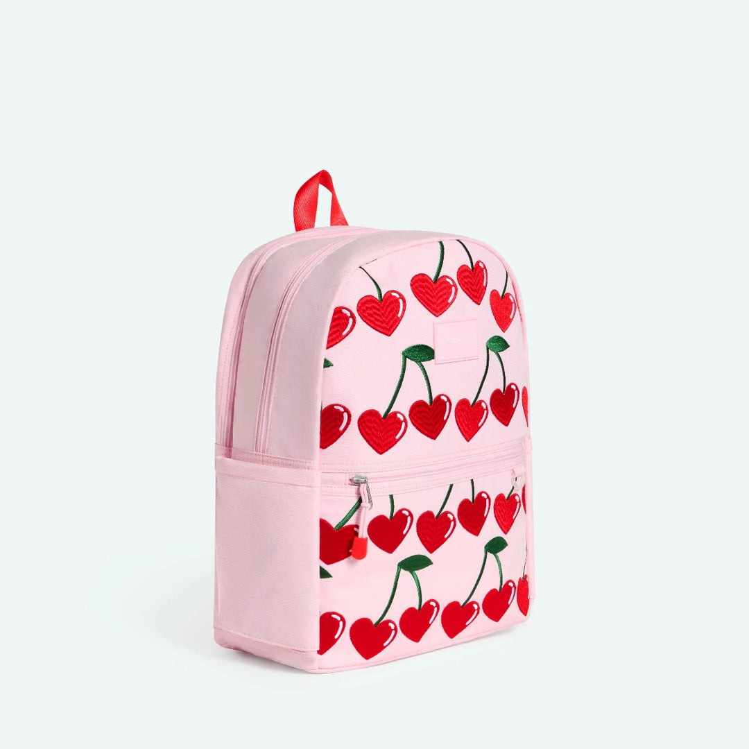 Pink backpack with red cherry pattern