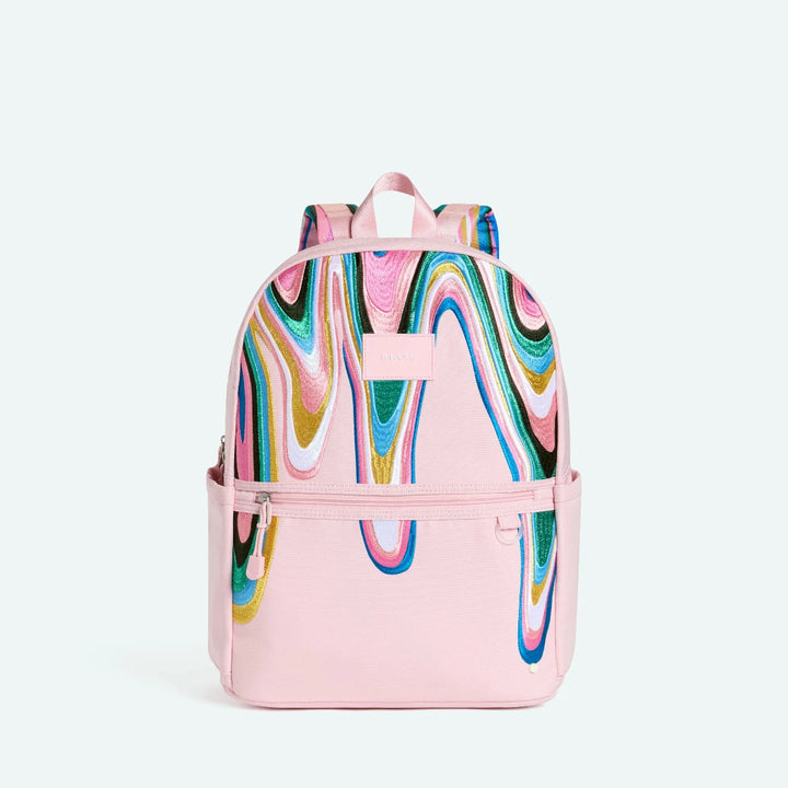 Pink backpack with colorful abstract design
