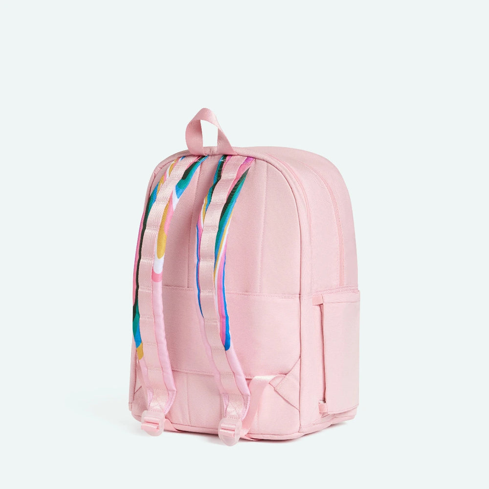 Pink backpack with colorful abstract design