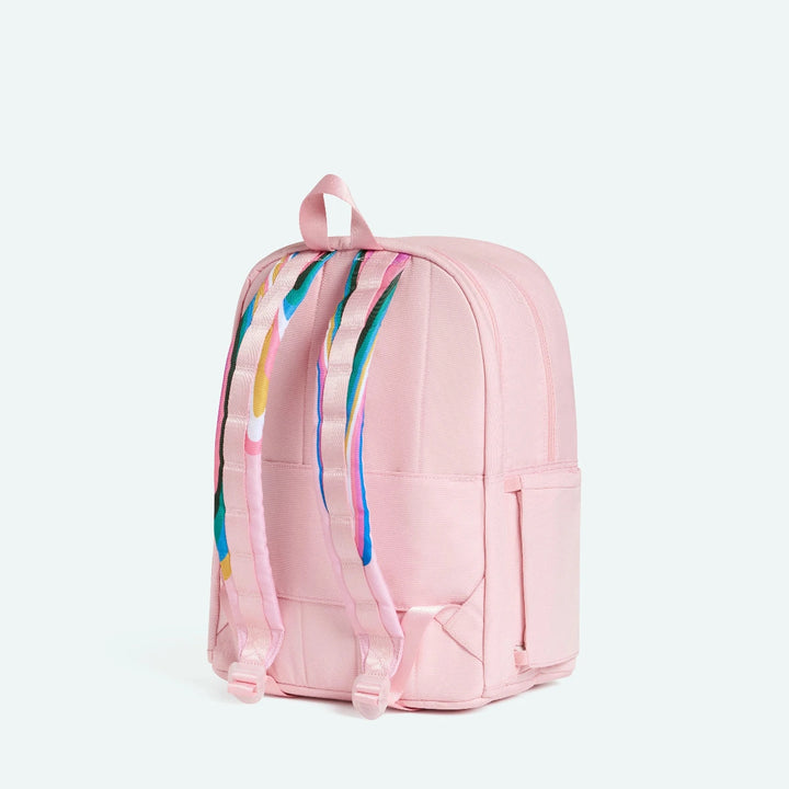 Pink backpack with colorful abstract design