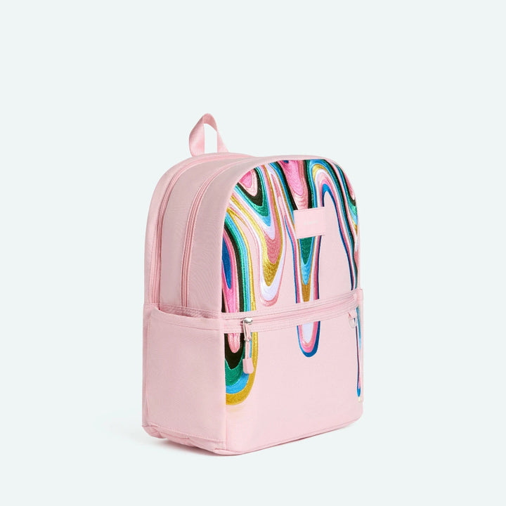 Pink backpack with colorful abstract design