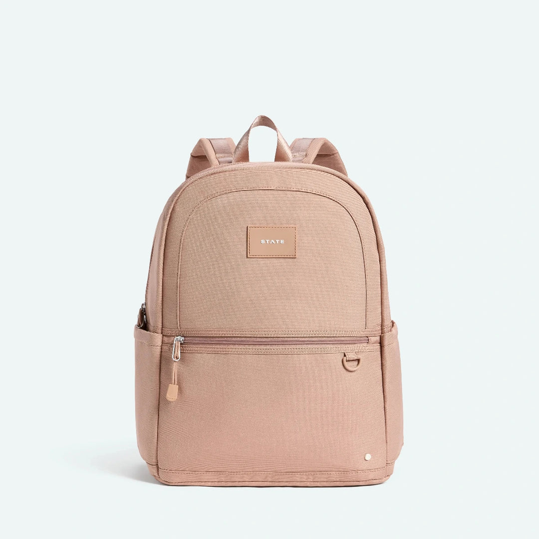 Beige backpack with a visible brand logo