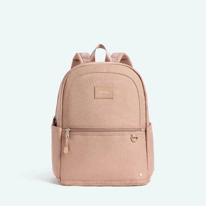 Beige backpack with a visible brand logo
